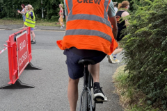 Steve Cram on the course making sure everything is going well and runners are safeon bike