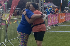 hugging on the finish line