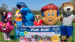Flamingo (Sonia Tudor, Wythall and Hollywood Fun Run Ambassador),Bob the Builder (Liz Frost, Wythall Community Association), Blue Tyrannosaurus Rex (Iain Gillett, Advanced Public Health Practitioner), Strawberry (Claudia Williams, Acorns Children’s Hospice), Alex the Acorn (Sam, Acorns Children’s Hospice) and Buddy the Dog, Best Start Family Hubs (Mat Wright, Stride Tribe and Wythall and Hollywood Fun Run Ambassador)
